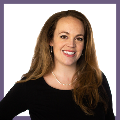 A woman with long brown hair smiles at the camera. She is wearing a black top and a pearl necklace. The background is white with a purple border.