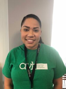 A person wearing a green 