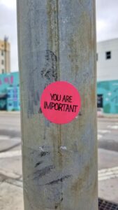 A pink sticker with the message 