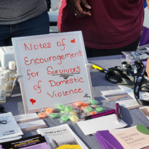 A table display at an event featuring a sign reading 