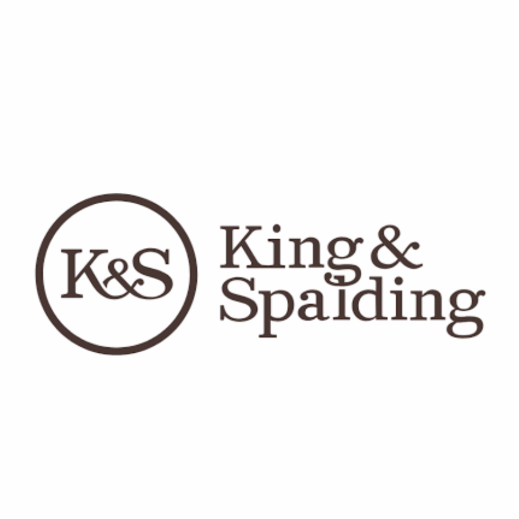 Logo for King & Spalding, featuring the initials "K&S" in a circle to the left of the firm's name written in a bold, serif font. The text is dark brown on a white background.