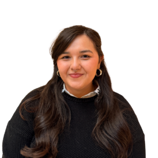 A woman with long dark hair, wearing a black sweater and hoop earrings, smiles at the camera against a plain white background.